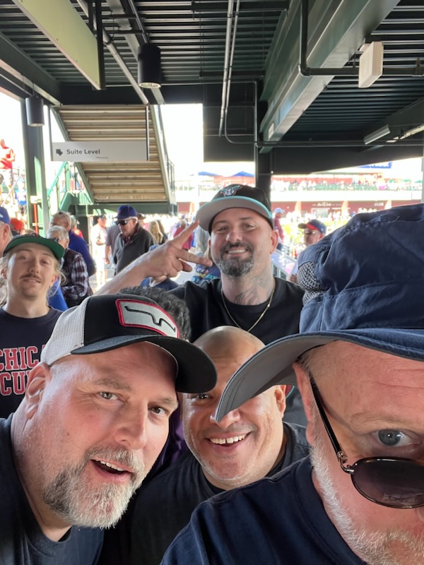 bryce fastener team enjoying cubs game